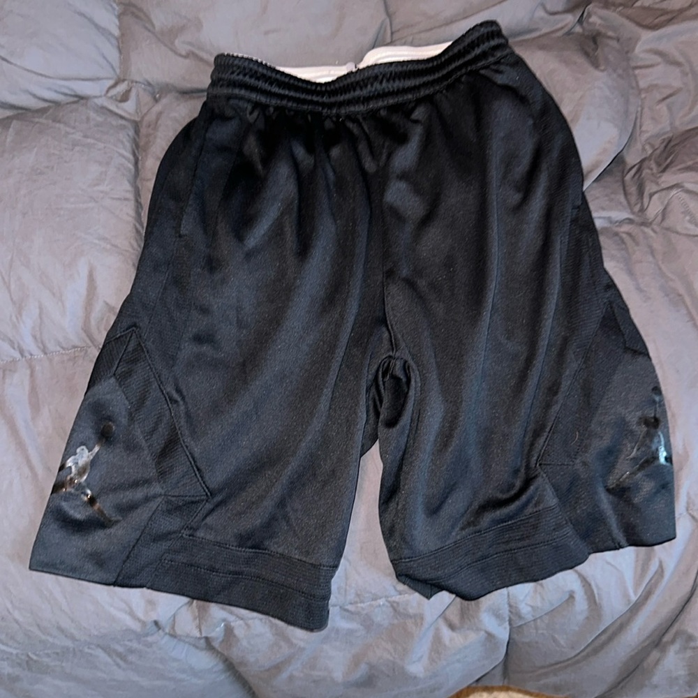Jordan Boys large basketball shorts with logos on the side. Black.